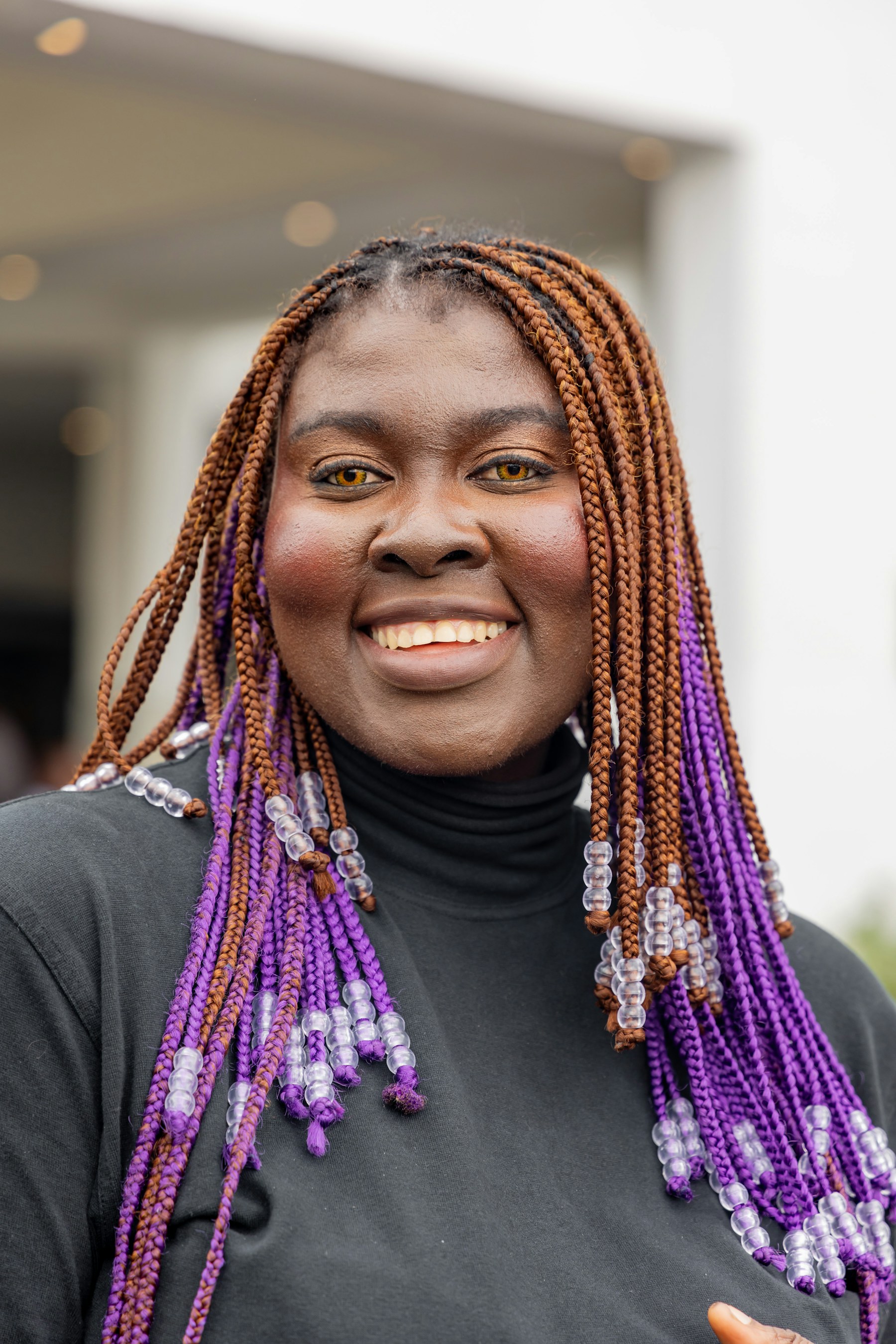Black woman wearing long braids